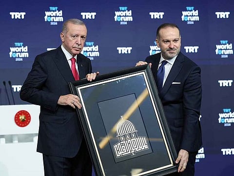 Recep Tayyip Erdoğan, President of the Republic of Turkey (on the left) AND Mehmet Zahid Sobacı, Director General of TRT.
