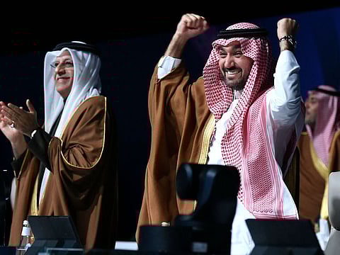 Saudi Arabia's delegates celebrate the winning bid