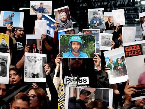 Mexican journalists and journalism students take part in a demonstration of solidarity and protest for the colleagues detained, disappeared, and killed in Gaza during the 38th edition of the International Book Fair in Guadalajara, Mexico, on December 5, 2024.