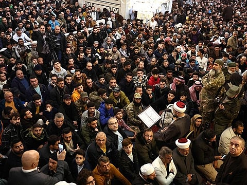 Syrians attend Friday prayers at the Umayyad Mosque in Damascus on December 13, 2024