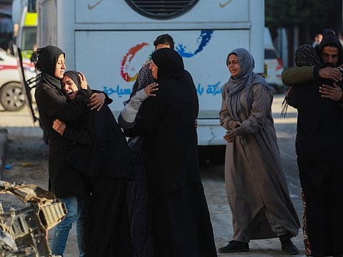 People mourn relatives killed in Israeli strikes on the Ahmad Abdulaziz UNRWA-run school currently housing displaced families, at the Nasser Hospital in Khan Yunis in the southern Gaza Strip on December 16, 2024.