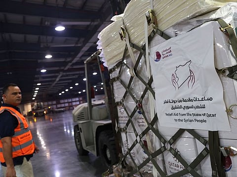 Humanitarian assistance is prepared to be loaded into a Qatari army plane to be sent to the Syria Via Marka Airport in Jordan, at the Al Udeid air base in Qatar, on December 10, 2024.