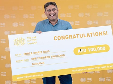 Mirza Omair Baig who won Dh100,000 with the Golden 7 Scratch Card.