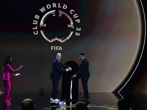 Fifa President Gianni Infantino and Ronaldo present The Fifa Club World Cup Trophy during the 2025 Fifa Club World Cup Draw at Telemundo Studios on December 05 in Miami, Florida.