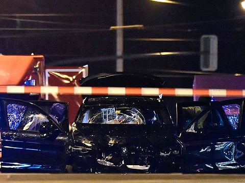 Forensics police inspect the car that crashed into a crowd at a Christmas market in Magdeburg, eastern Germany, on December 21, 2024