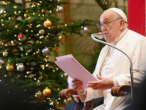This handout photograph taken on December 21, 2024 released by the Vatican media shows Pope Francis giving Christmas greetings to the Roman Curia in the Vatican.