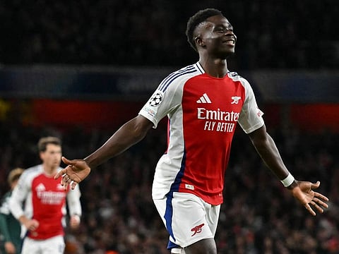 Arsenal's English midfielder Bukayo Saka celebrates scoring the team's second goal during the Uefa Champions League football match against Monaco at the Emirates Stadium in north London, on December 11.