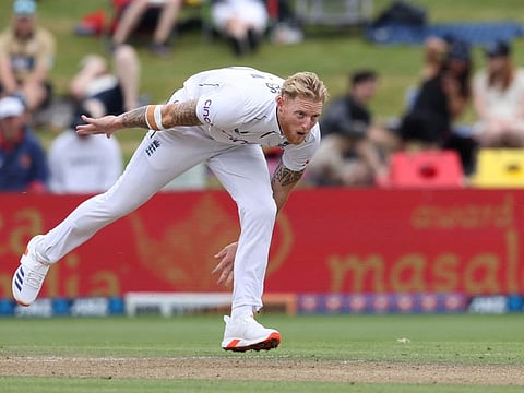 Englands Ben Stokes bowls on day three of the third cricket Test match against New Zealand at Seddon Park in Hamilton on December 16.