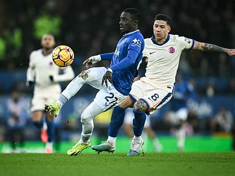 Everton's Senegalese midfielder Idrissa Gueye (centre) controls the ball past Chelsea's Argentinian midfielder Enzo Fernandez during the English Premier League football match at Goodison Park in Liverpool on Sunday.