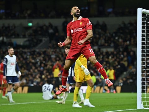 Liverpool's Egyptian striker Mohamed Salah celebrates after scoring their fifth goal during the English Premier League football match against Tottenham Hotspur at the Tottenham Hotspur Stadium in London on Sunday.