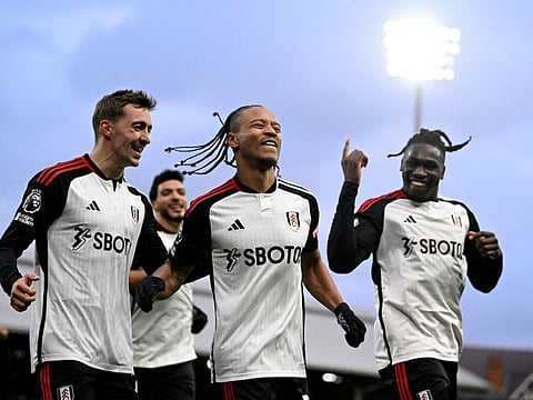 Fulham's Bobby Decordova-Reid celebrates scoring their second goal with Timothy Castagne and Calvin Bassey during a Premier League match against Arsenal at Craven Cottage, London, on Sunday.