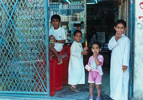 Children at a grocery store in Hatta, Dubai, in 1994.