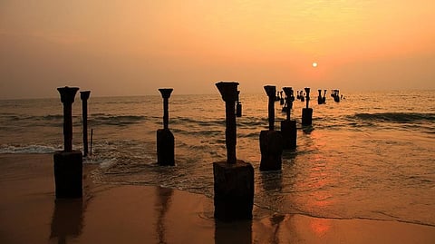 Silhouettes of sea piers at sunset in Calicut, Kerala. Sebastian R Prange spent more than six months travelling along the Malabar coast, piecing together the history of Muslim traders whose arrival helped enrich the region’s culture