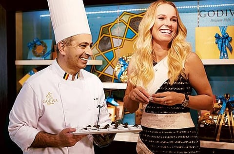 With tennis star Caroline Wozniacki, Godiva’s brand ambassador.