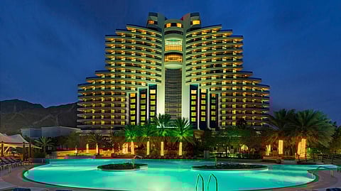 This chic Indian Ocean resort hotel with iconic architecture is set against the extraordinary backdrop of the Hajar Mountains