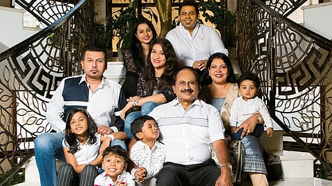 Babu with his family – his wife Daisy (right) is a pillar of his success