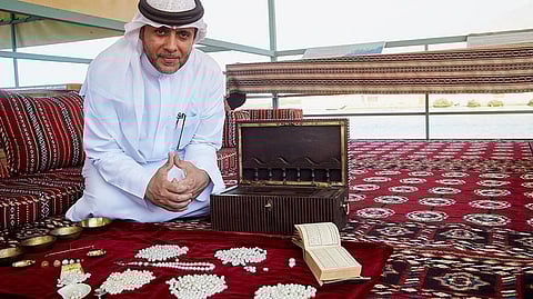 Abdullah Al Suwaidi displays the huge variety of pearls that have been harvested from Al Rams’ waters