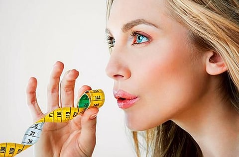 Eat with your non-dominant hand to reduce consumption.