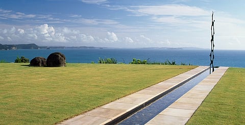 In this coastal garden, a clean-lined rill and infinity edge leads the eye to the sculpture. Photos by Nicola Brown/Gap Photos, Design by Ted Smyth