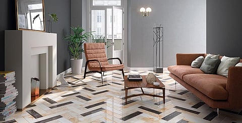 Marble tiles of varying shades – black, gold, ivory and beige – from RAK Ceramics’ Fashion Marble collection are arranged in a chevron pattern for a bold flooring statement that complements the interiors highlighting hues from the furnishings to the fixtures. Tiles available in a choice of six colours in glossy or matte finish.