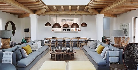 The living room is based on a Megaron, an architecture form found in ancient Greece. The large square room has a central skylight so you can look up and see the sky while the interior is open to the exterior vertically. In this case, the room can be opened on three sides. The symmetry of the set up is very appealing