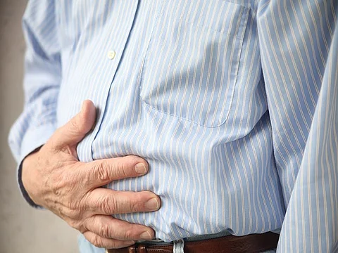 a woman throwing up holding her stomach
