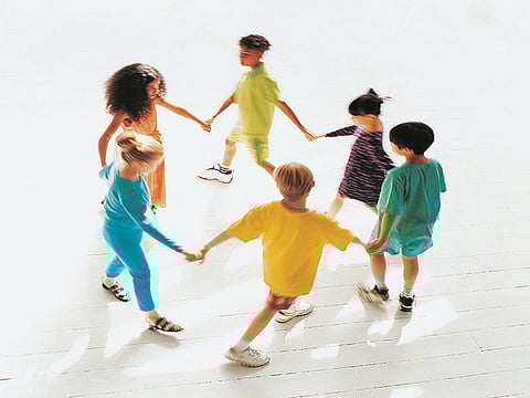 kids holdings hands in a circle