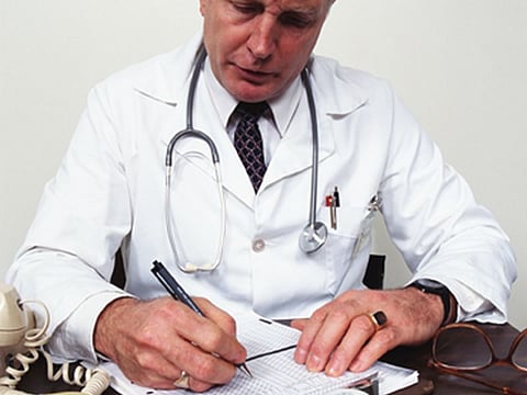 doctor writing prescription