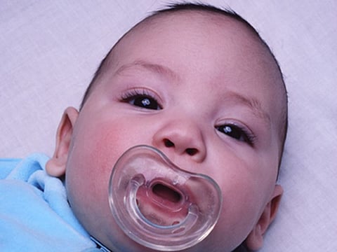 newborn with pacifier