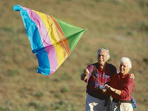 older couple flying kite