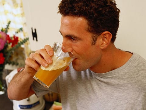 man drinking juice