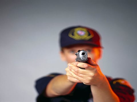 police officer pointing with the gun