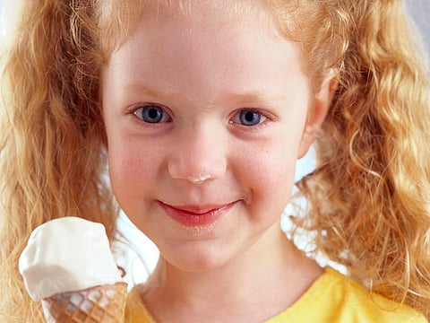girl eating ice cream cone