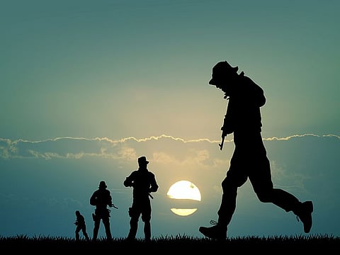 soldiers silhouette at sunset