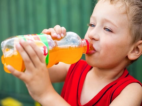 boy drinking soda