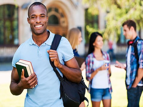 college man with backpack