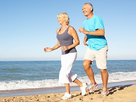couple running on the beach