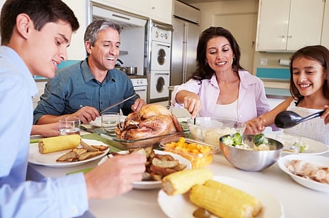 family enjoying meal together at the table