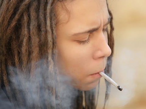 teen boy smoking marijuana
