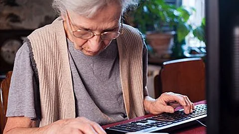 older woman sitting at the computer