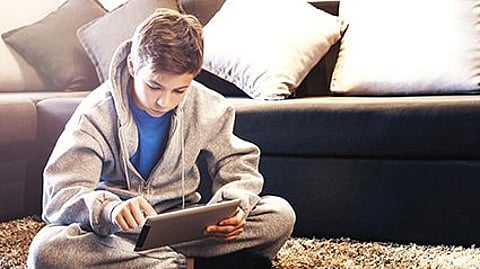 a boy on the ipad