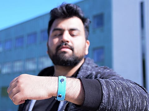 Co-creator Muhammad Umair wears prototype wristband