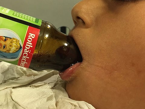 Patient with tongue trapped in bottle