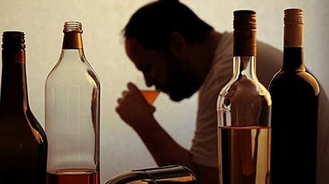 a man drinking alcohol