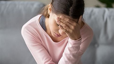 a woman with a headache