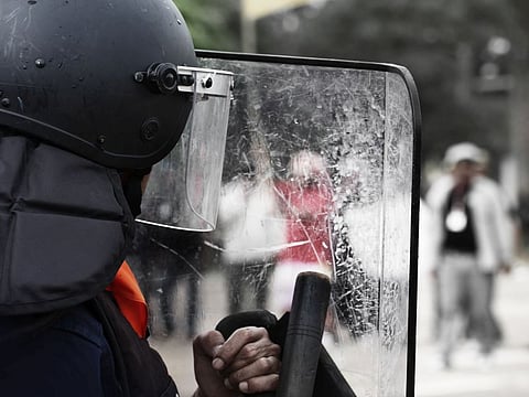 Police and shields during a riot