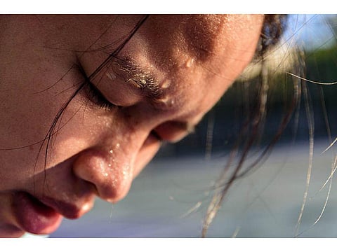 sweat dripping on woman's face