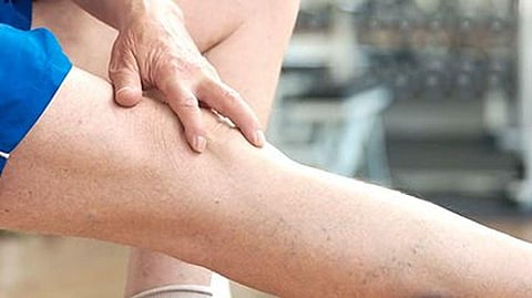 a person holding his leg