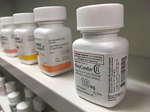 prescription pills containers on the shelve