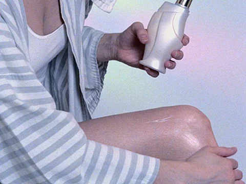 woman putting the cream on